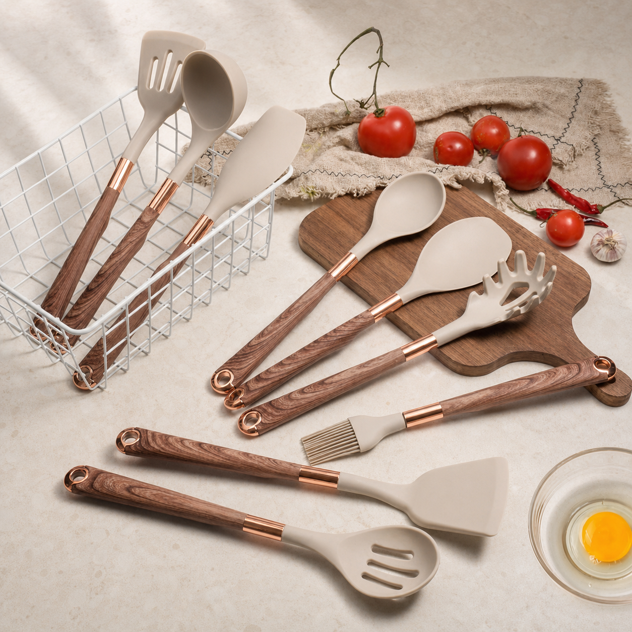 Silicone kitchen utensils with wooden handles on a kitchen counter